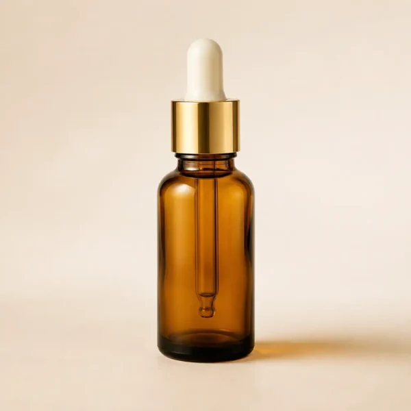 Amber glass dropper bottle with gold cap for fragrance oil packaging
